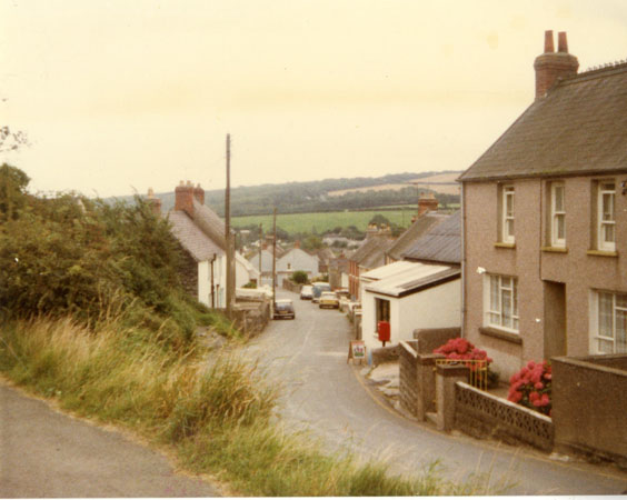 Coloured photograph of Main Street Llangwm showing the shop